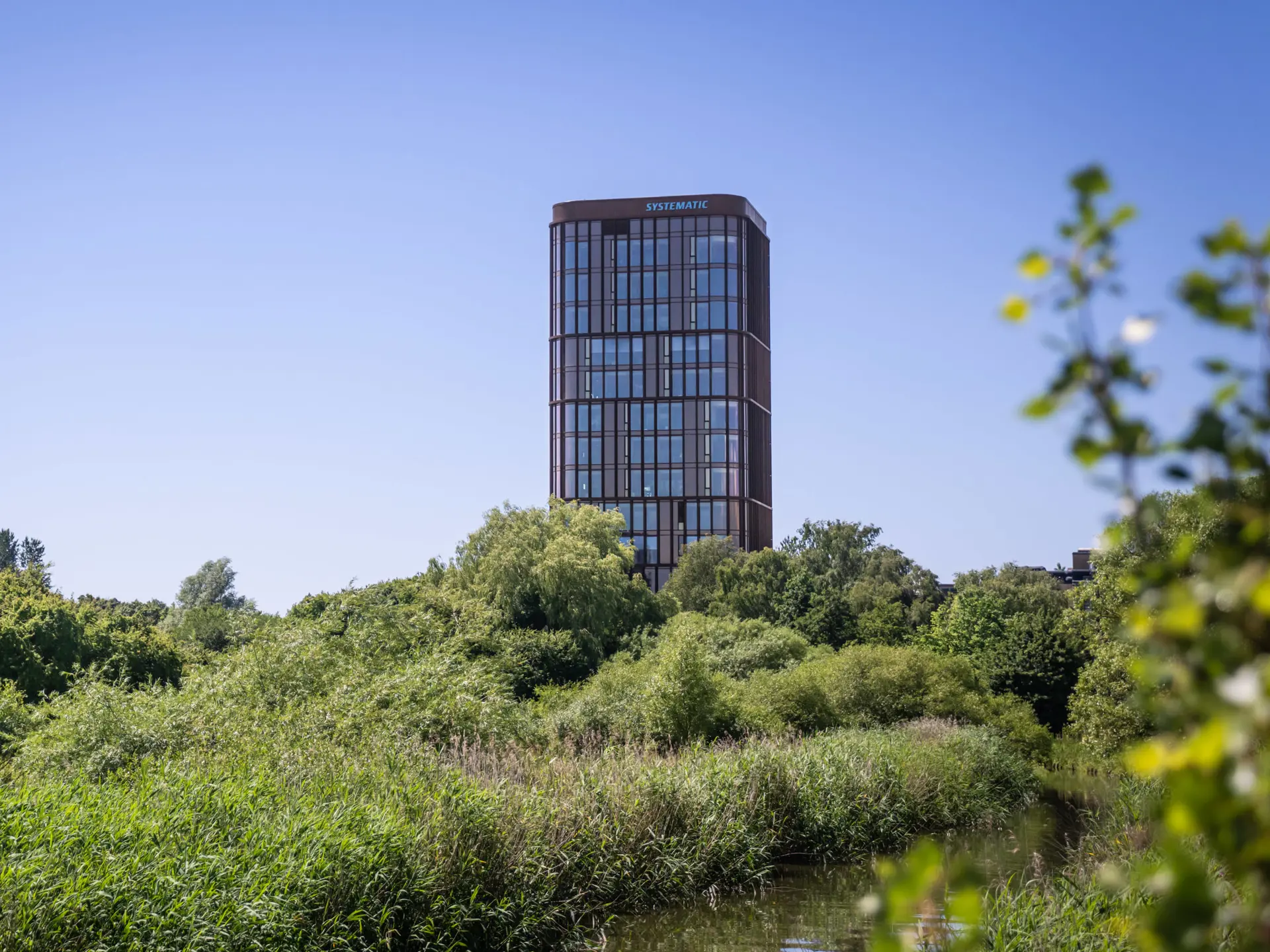 Systematic A/S Headquarters tower with clear blue sky in Aarhus